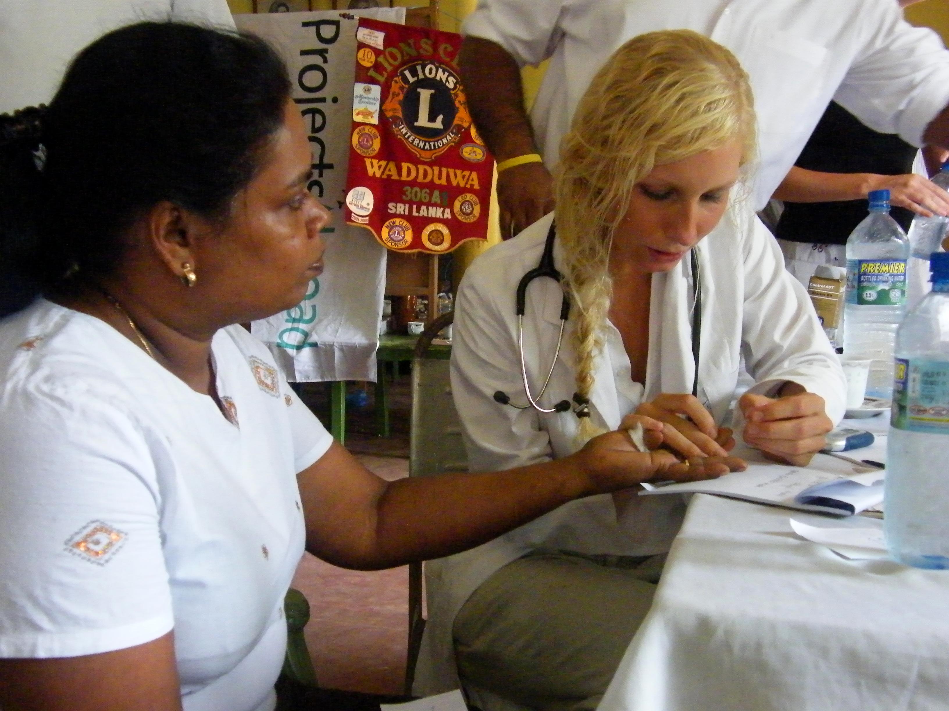 A female Projects Abroad intern taking blood sugar levels of a local woman whilst on her nursing internship in Sri Lanka. An intern from Projects Abroad is pictured taking blood sugar levels of a local woman whilst undertaking her nursing internship in Sri Lanka.